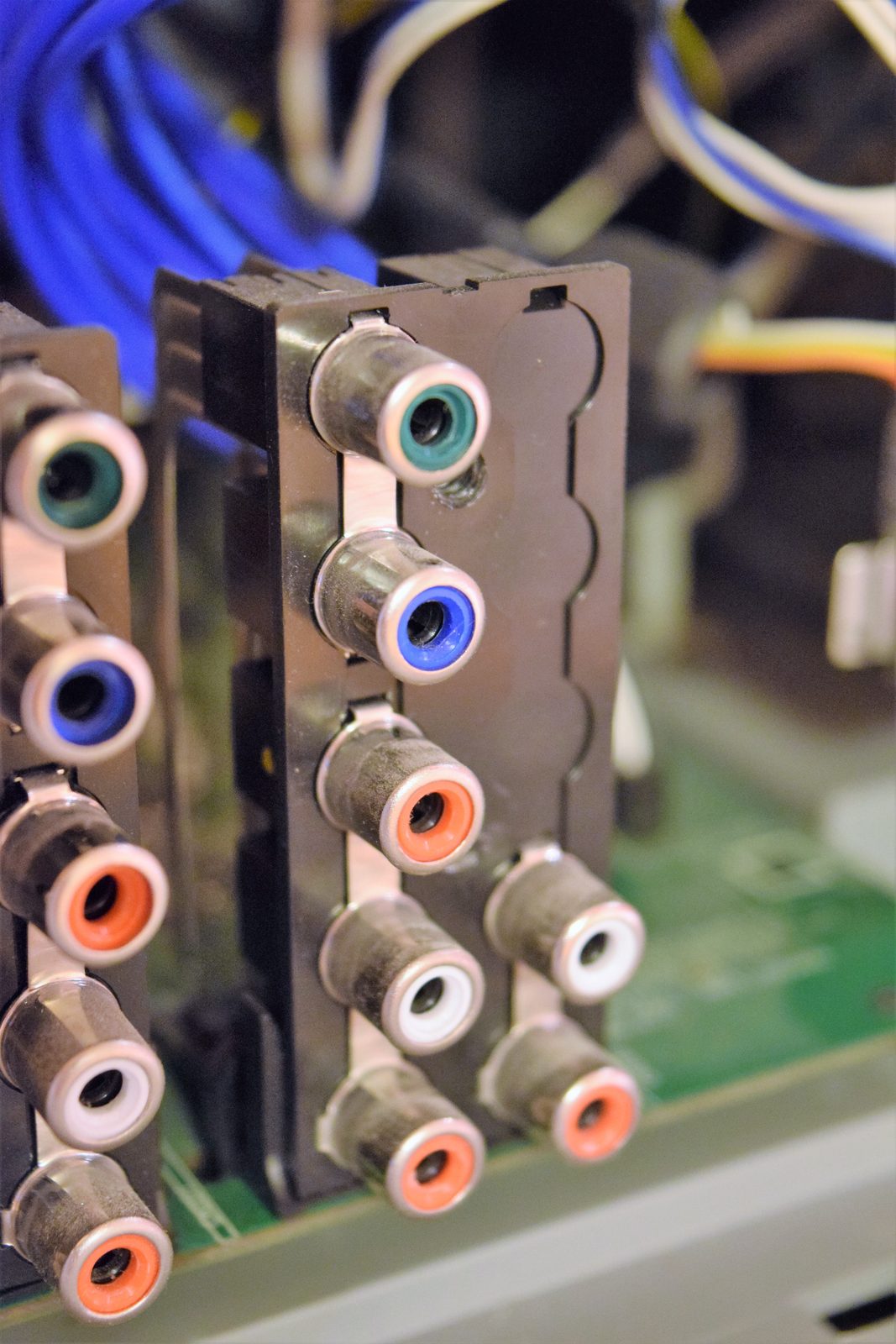 Close-up of TV connector inspection at the Silman TV Repairs workshop